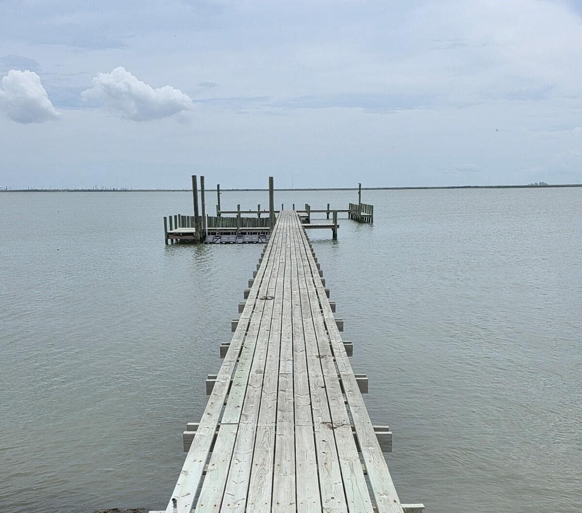 300 ft, extra-wide pier with boat slip and 3 jet ski ramps with cranks